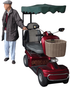 Elderly man standing next to mobility scooter